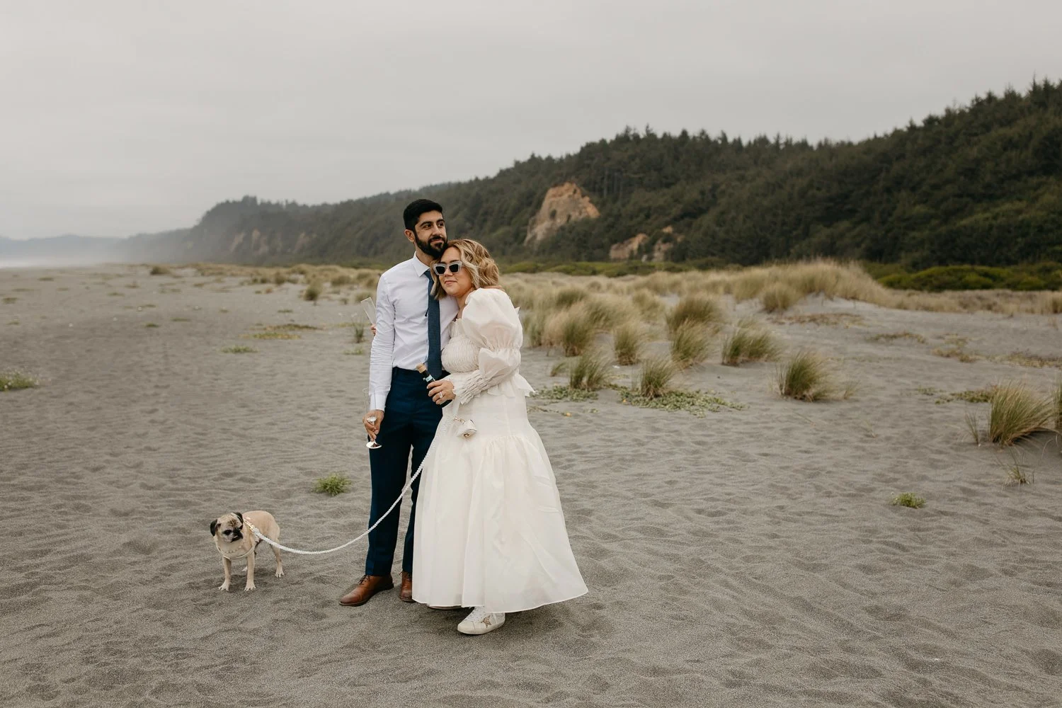 Couple with their dog during a dog-friendly elopement on a Northern California beach
