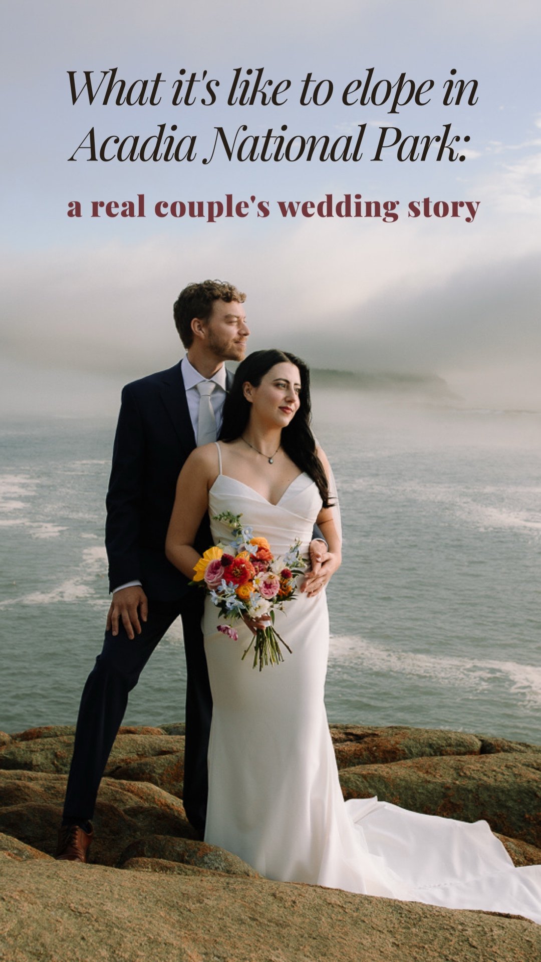Bride and groom standing together on a cliff in Acadia National Park with fog rolling over the ocean behind them.