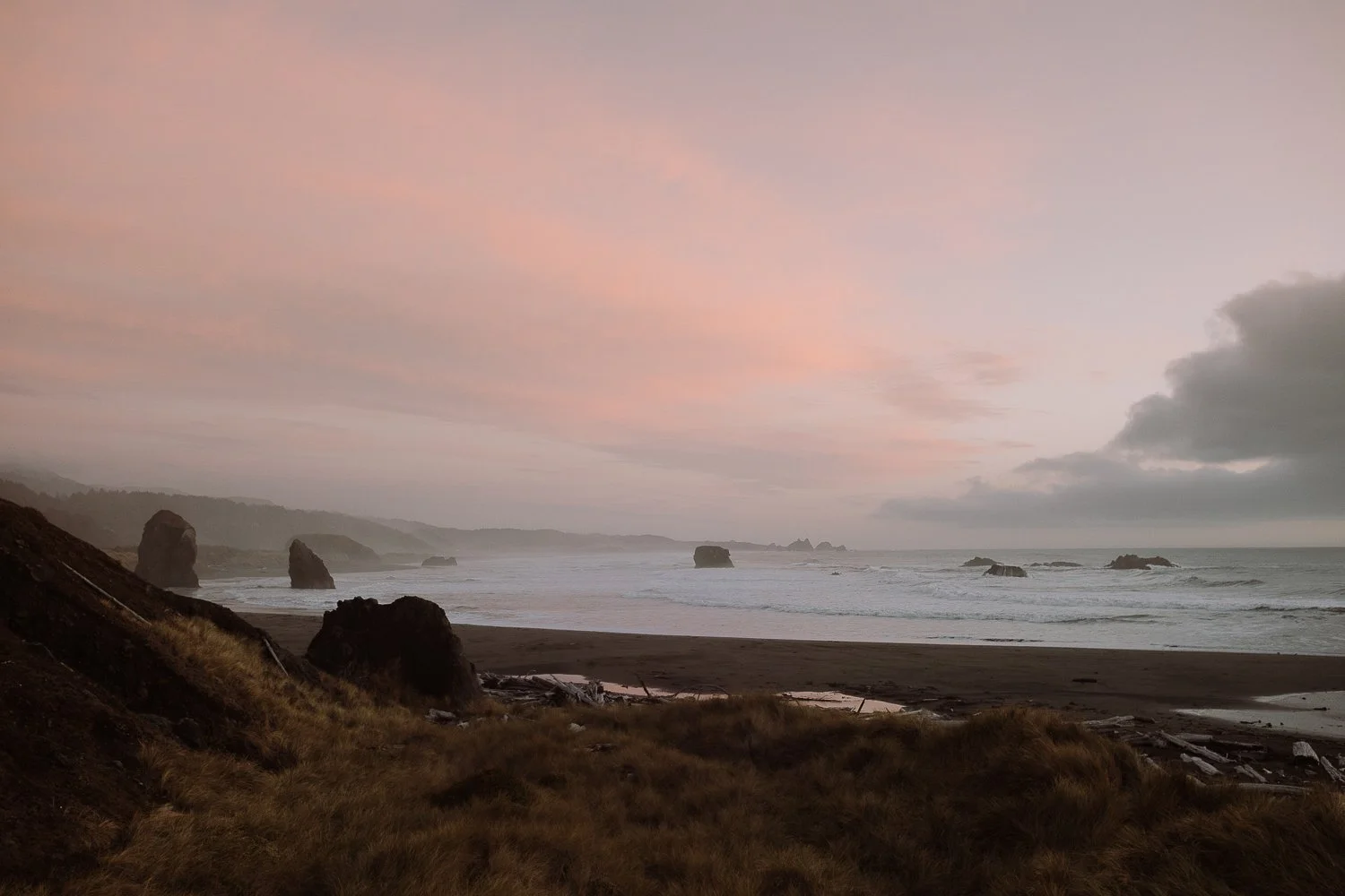 Soft pastel sunrise over the southern Oregon coastline