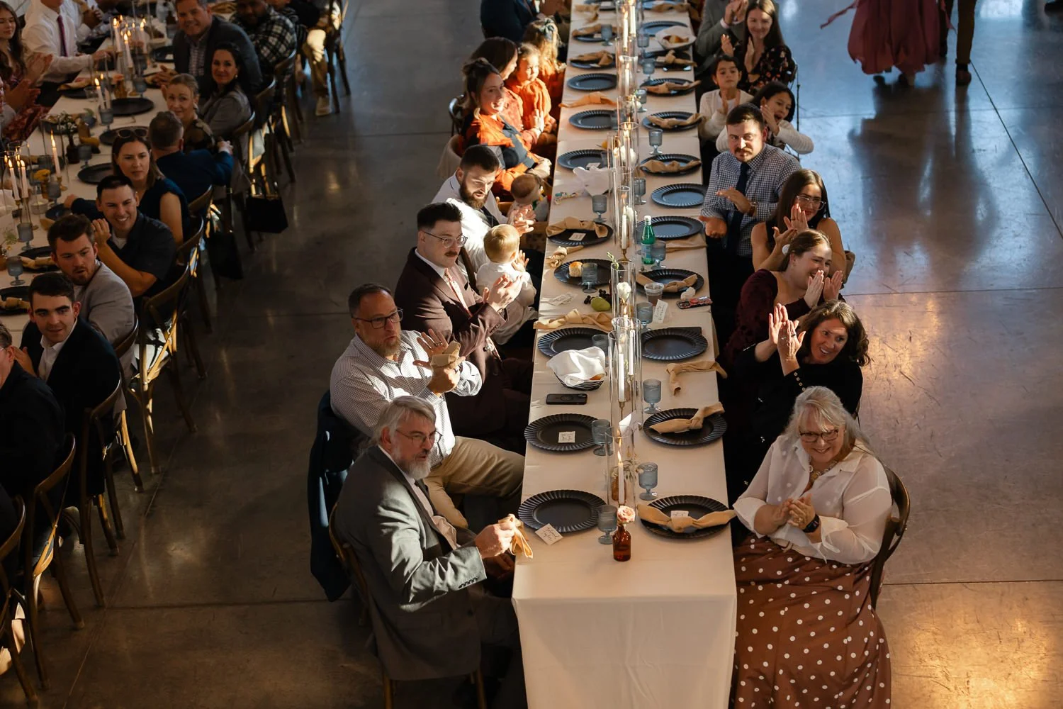 Wedding guests applauding during dinner at an Ivory Meadows wedding in Dayton, Ohio.