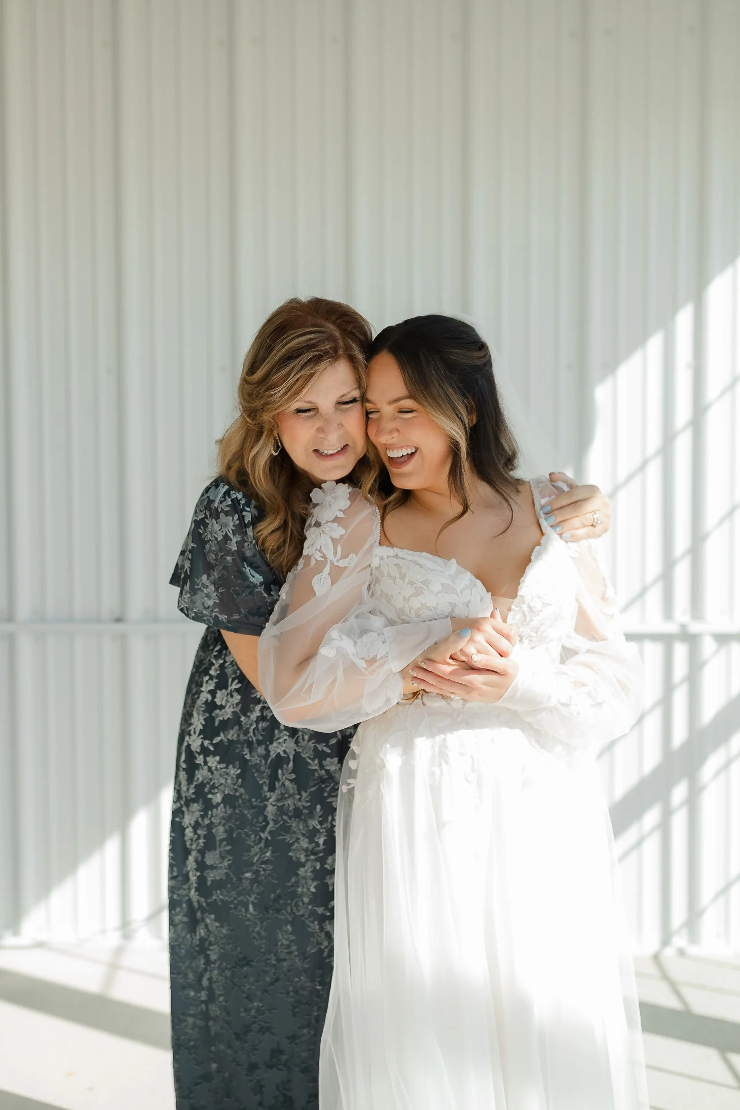 Bride sharing a quiet moment with her mother during getting ready at Ivory Meadows in Yellow Springs, Ohio.
