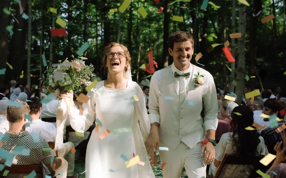 Couple walking back up the aisle during a woodland wedding ceremony in Dayton, Ohio