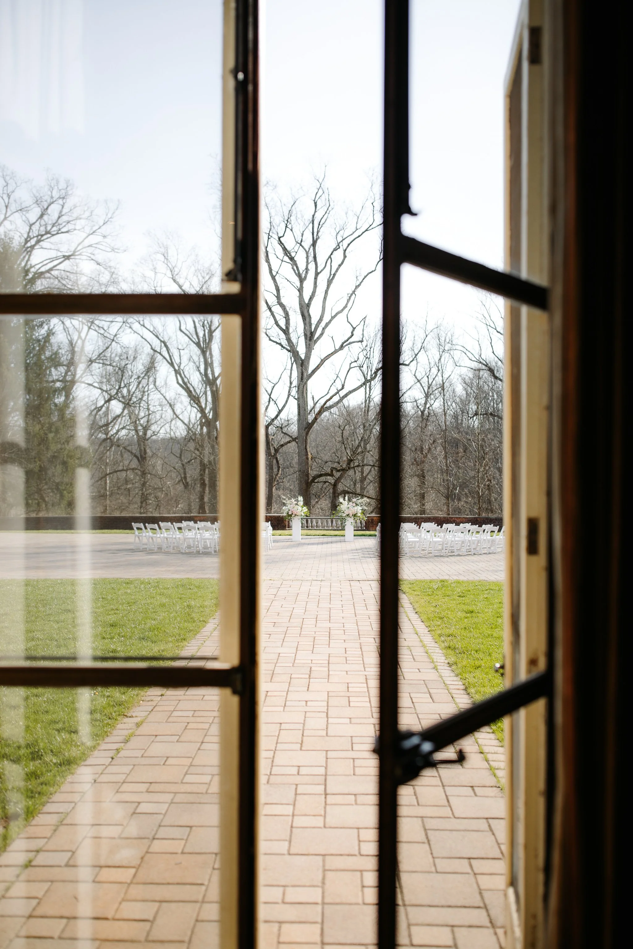 Open doors leading to terrace ceremony space at Peterloon Estate