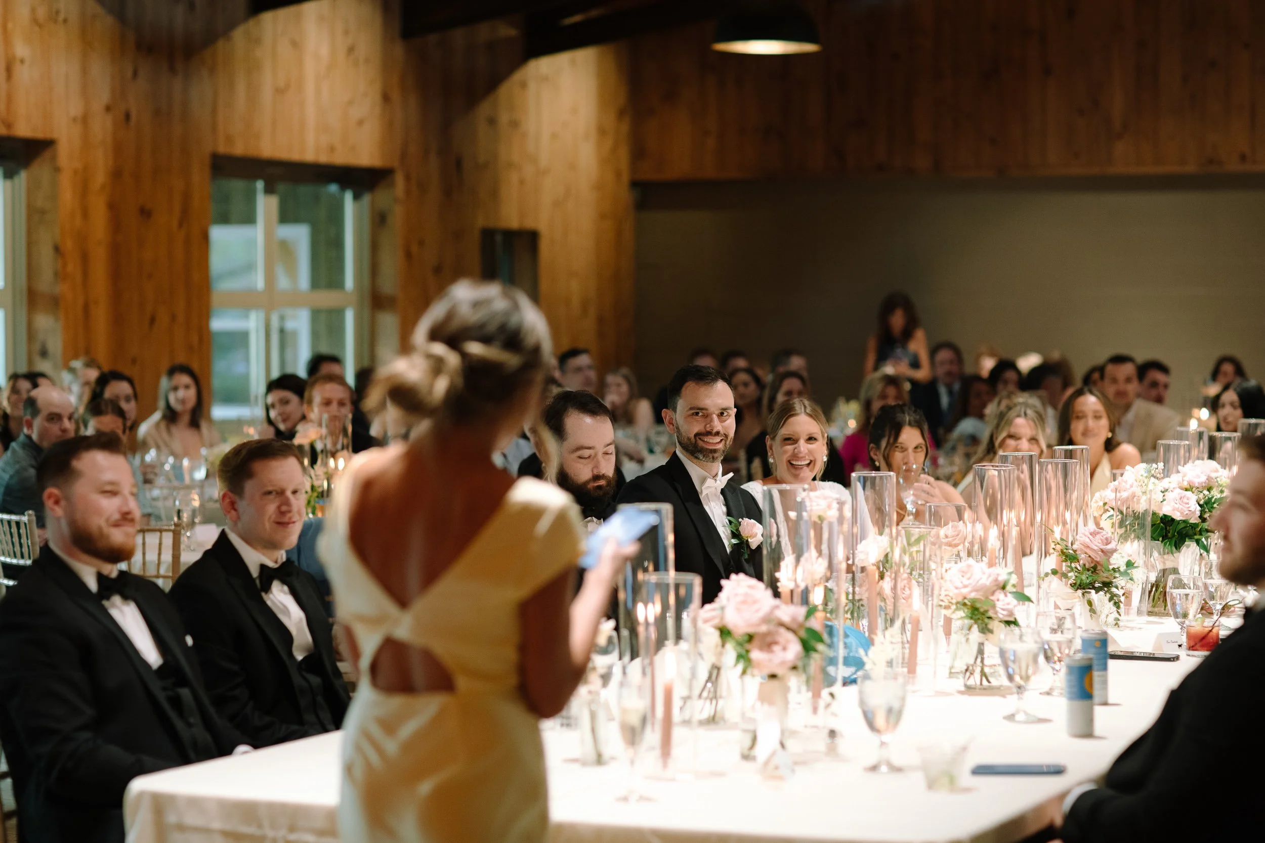 Bridesmaid giving a toast during the candlelit reception at Jorgensen Farms in Columbus, Ohio.