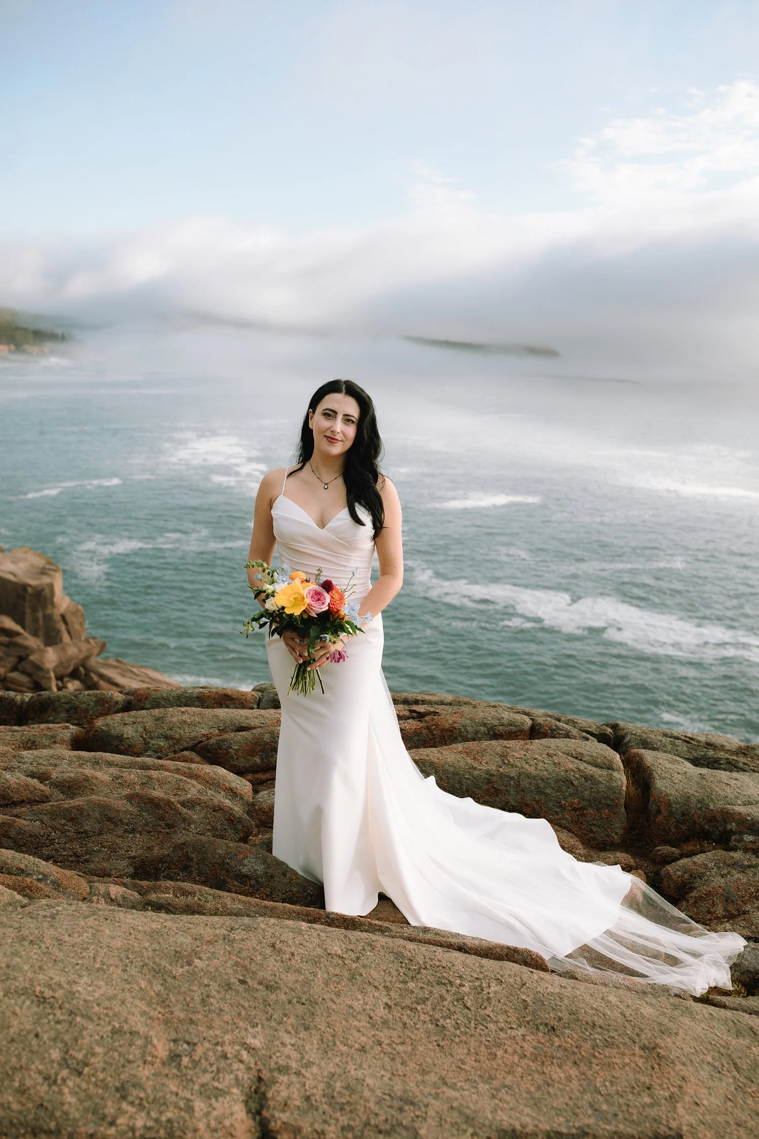 Bride portrait overlooking the Atlantic Ocean during an Acadia National Park elopement on the Maine coast.