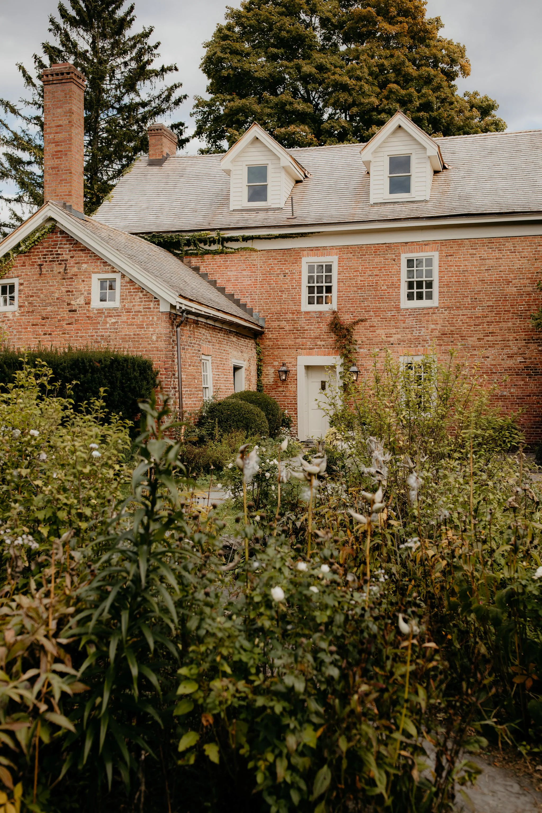 Garden view of Windrift Hall, a historic Hudson Valley estate often used for Catskills region wedding weekends