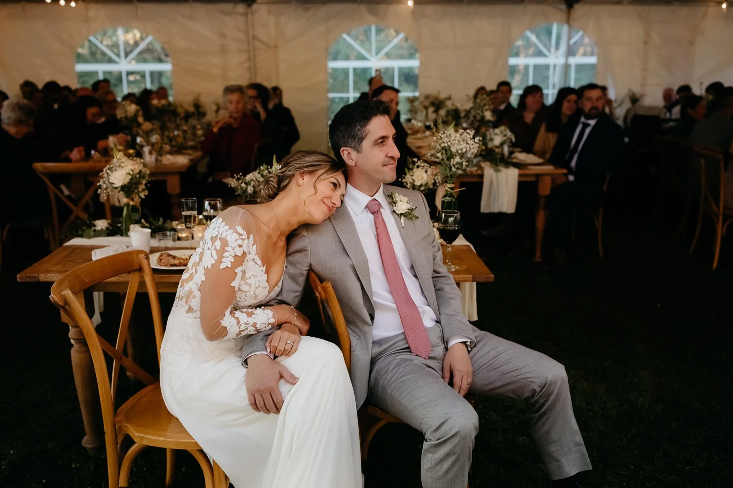 Bride leaning on groom during heartfelt reception speeches at a Catskills wedding
