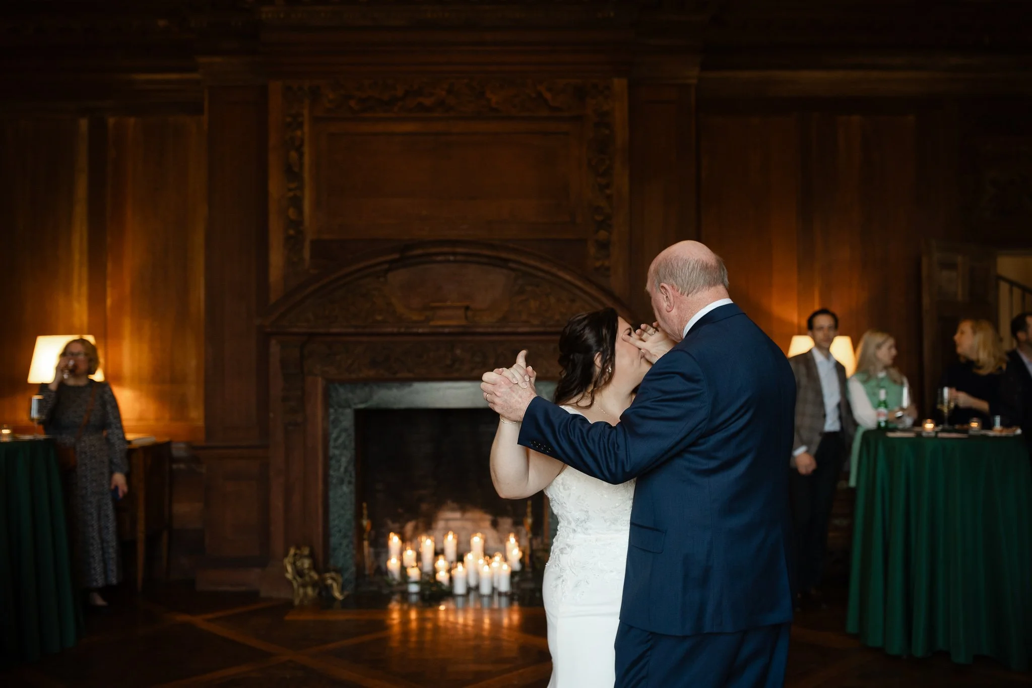 Father and daughter dancing near fireplace inside Peterloon Estate