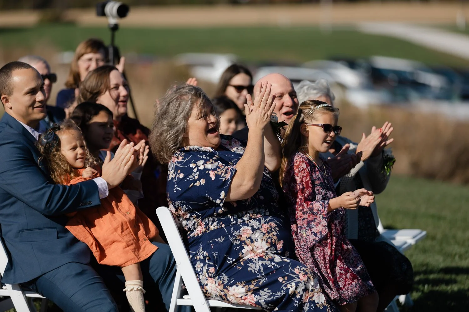 Wedding guests reacting with joy during an outdoor ceremony at Ivory Meadows near Dayton