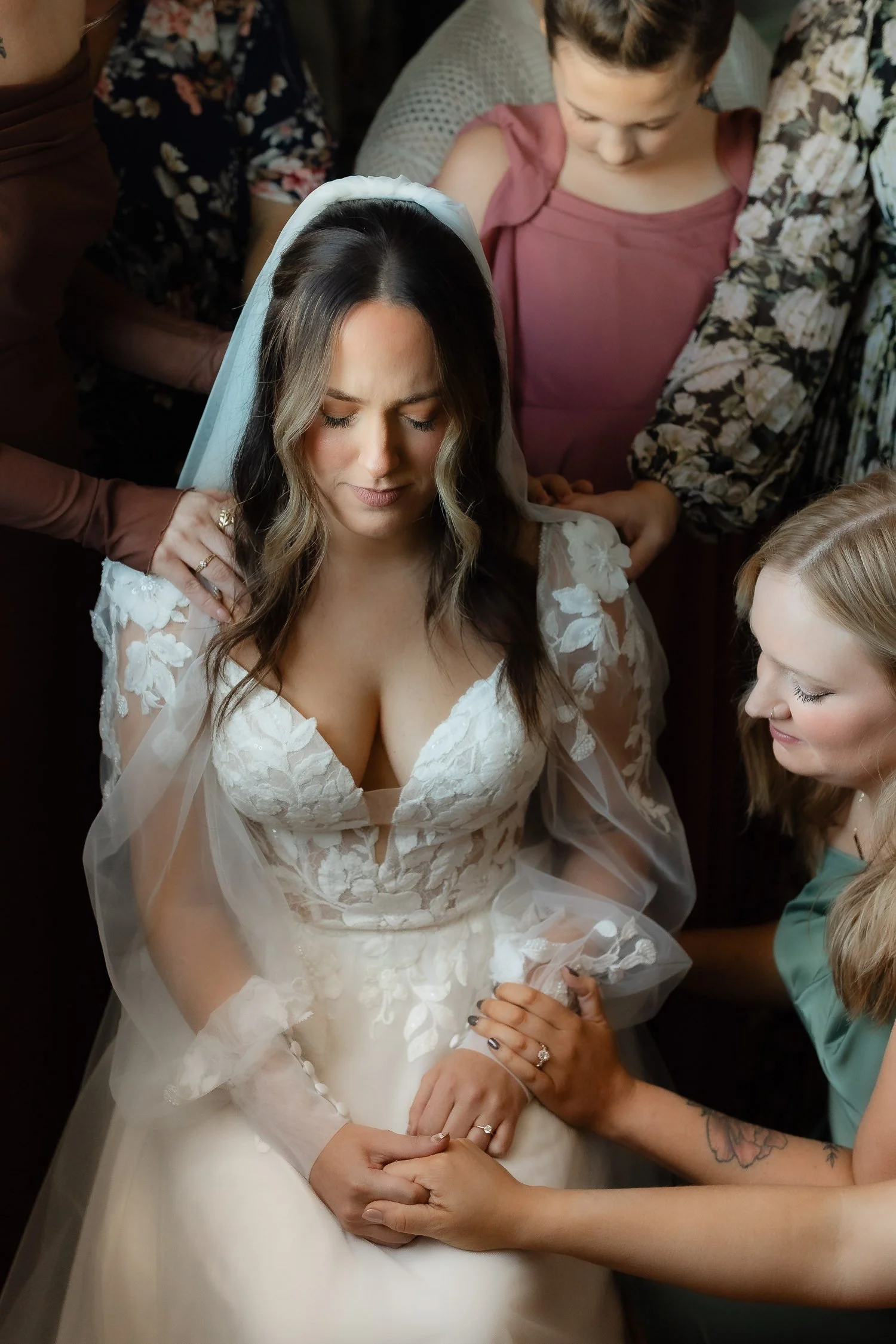 Emotional prayer moment with the bride in the getting ready suite at an Ivory Meadows wedding in Yellow Springs, Ohio.