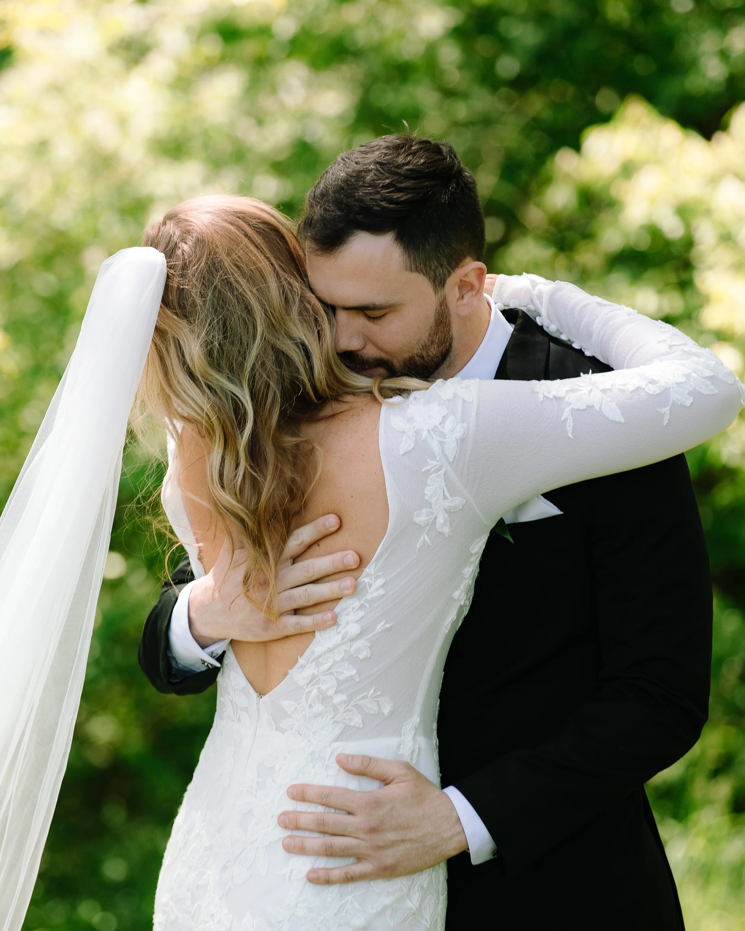 Bride and groom embracing during their private vow exchange at Jorgensen Farm The Gardens in Columbus.