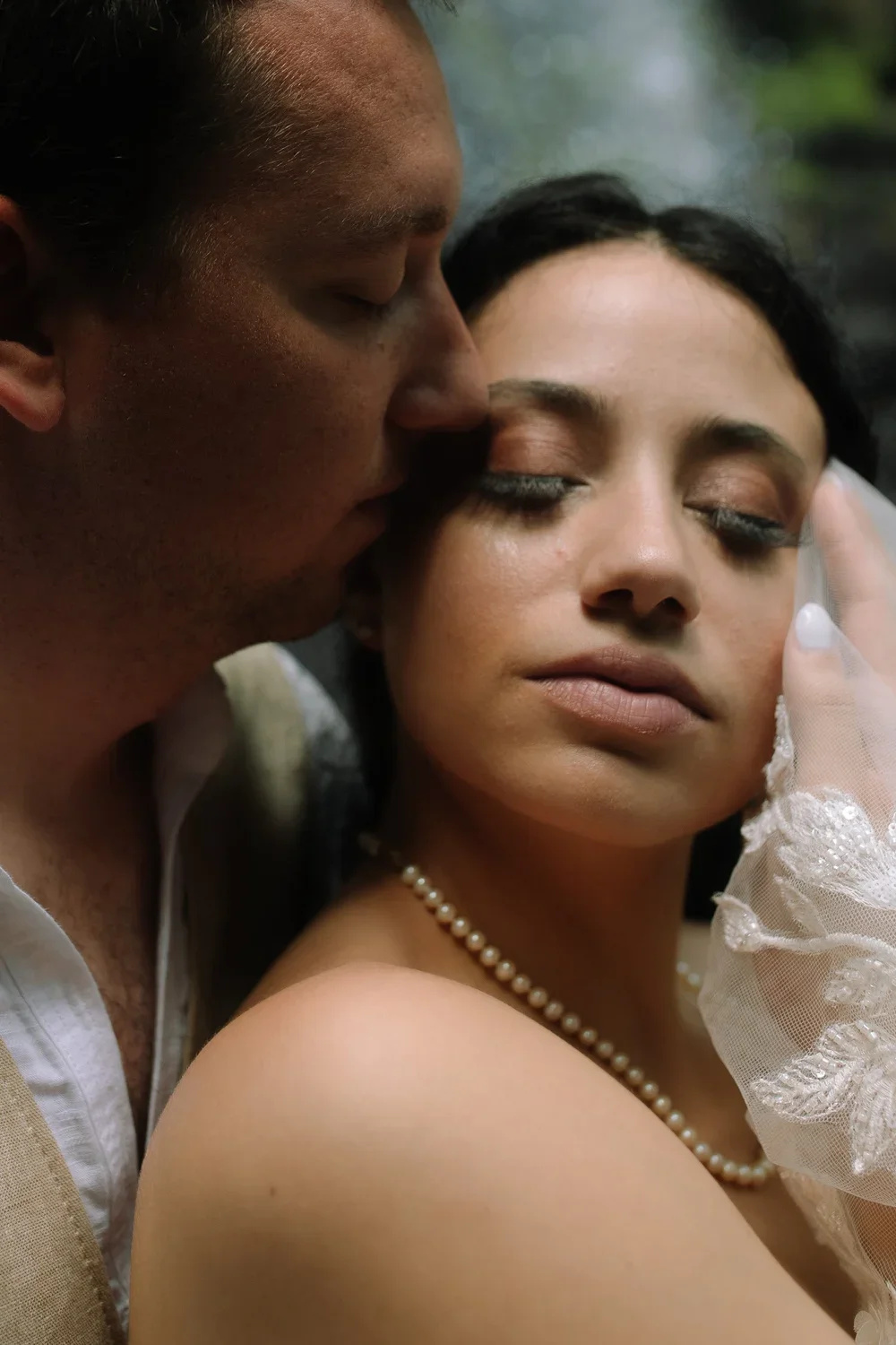 Intimate close-up portrait of a couple during their El Yunque waterfall elopement in Puerto Rico