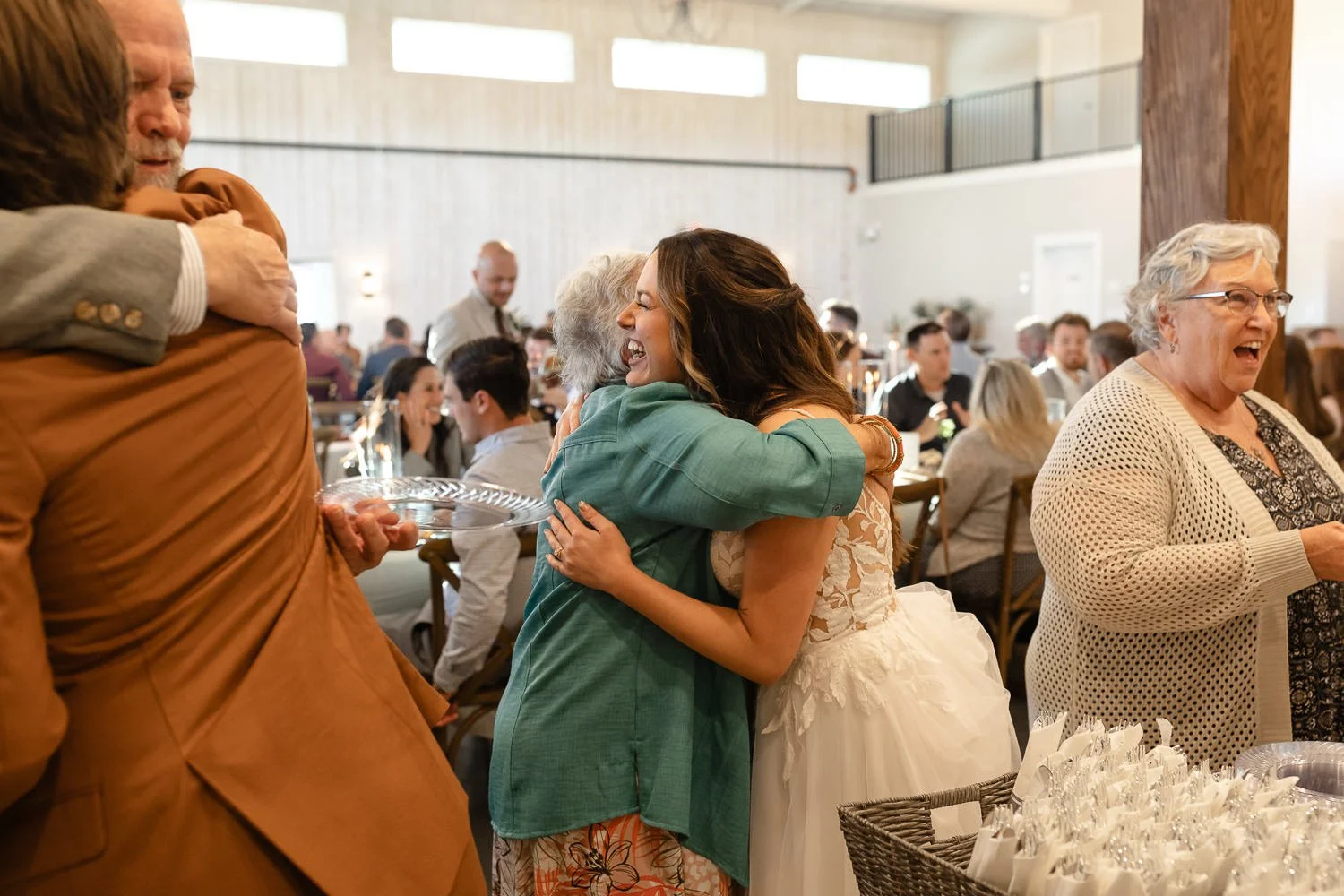Bride greeting and hugging guests during the reception at Ivory Meadows in Dayton, Ohio.