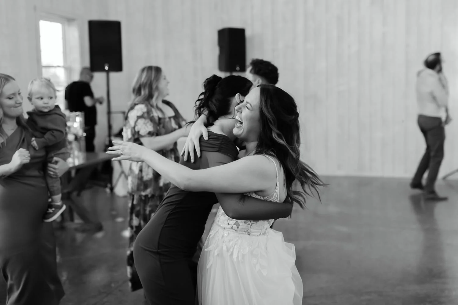 Emotional embrace during a wedding reception at Ivory Meadows in Dayton Ohio