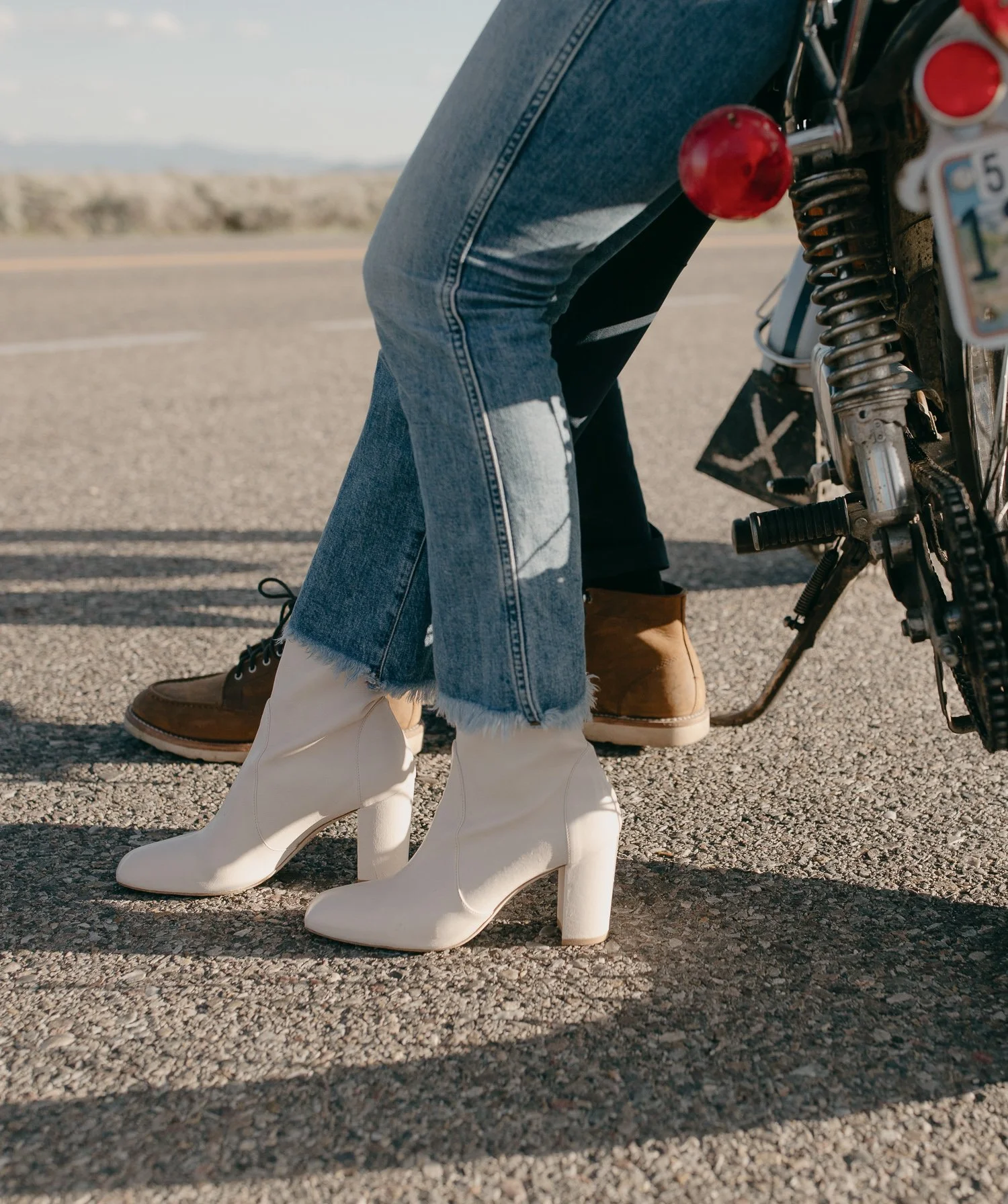 Close up of boots and motorcycle details during engagement session
