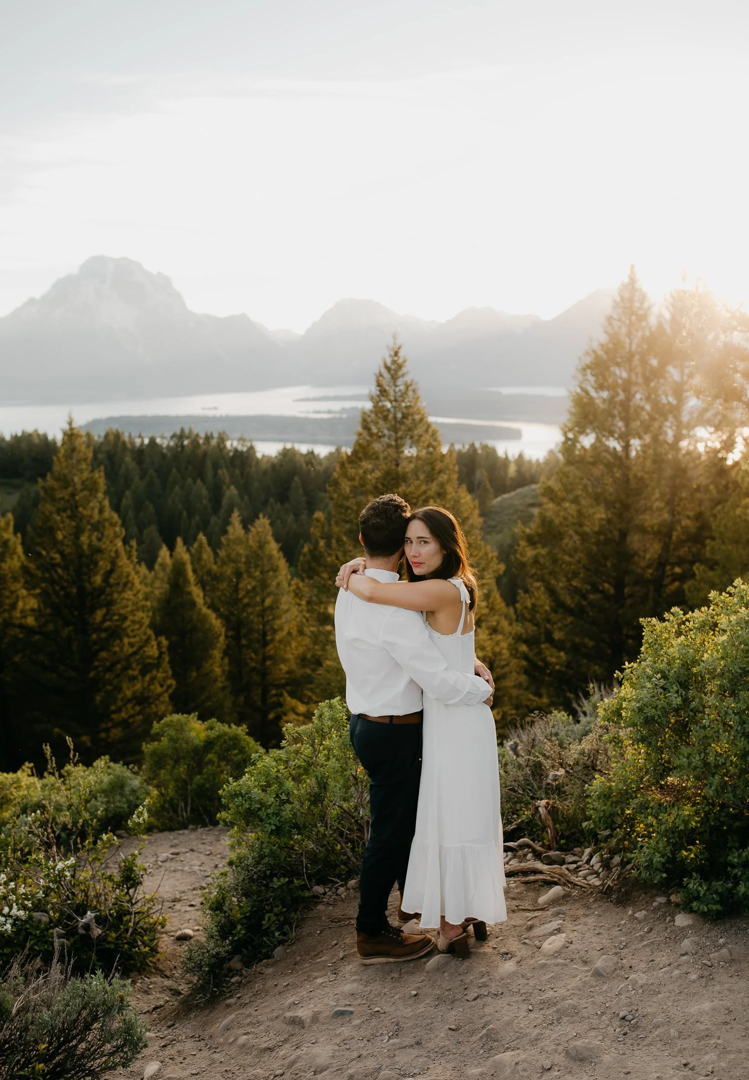 Couple embracing at Signal Mountain overlook in Grand Teton National Park