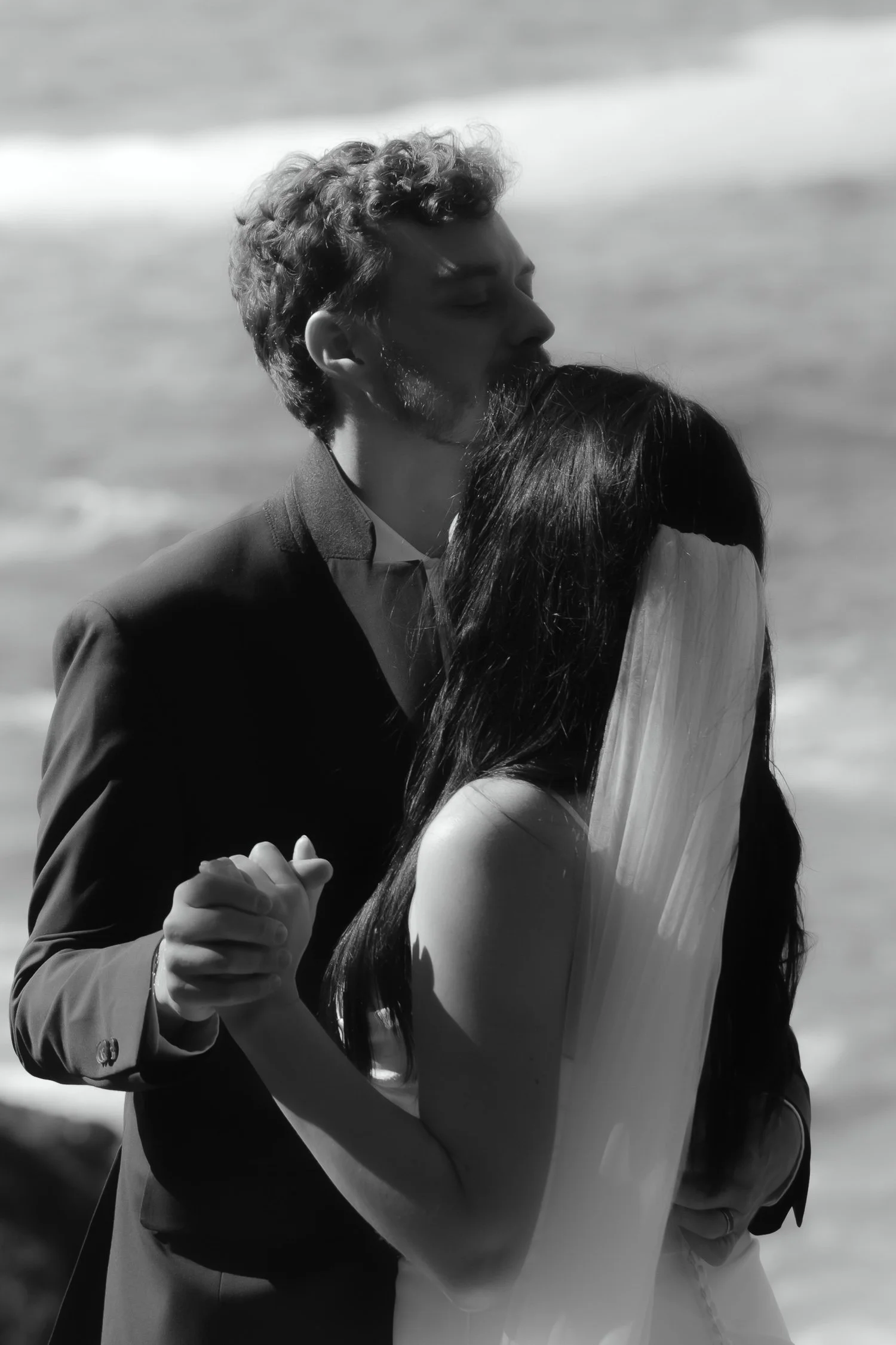 Black and white photo of bride and groom sharing a private first dance during their Acadia elopement