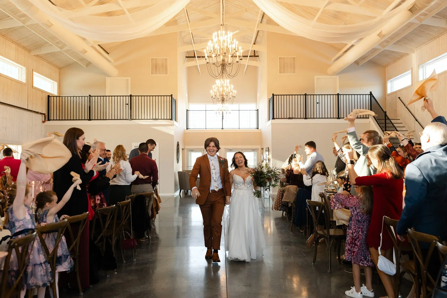 Bride and groom making their grand entrance into the reception at Ivory Meadows in Dayton, Ohio.