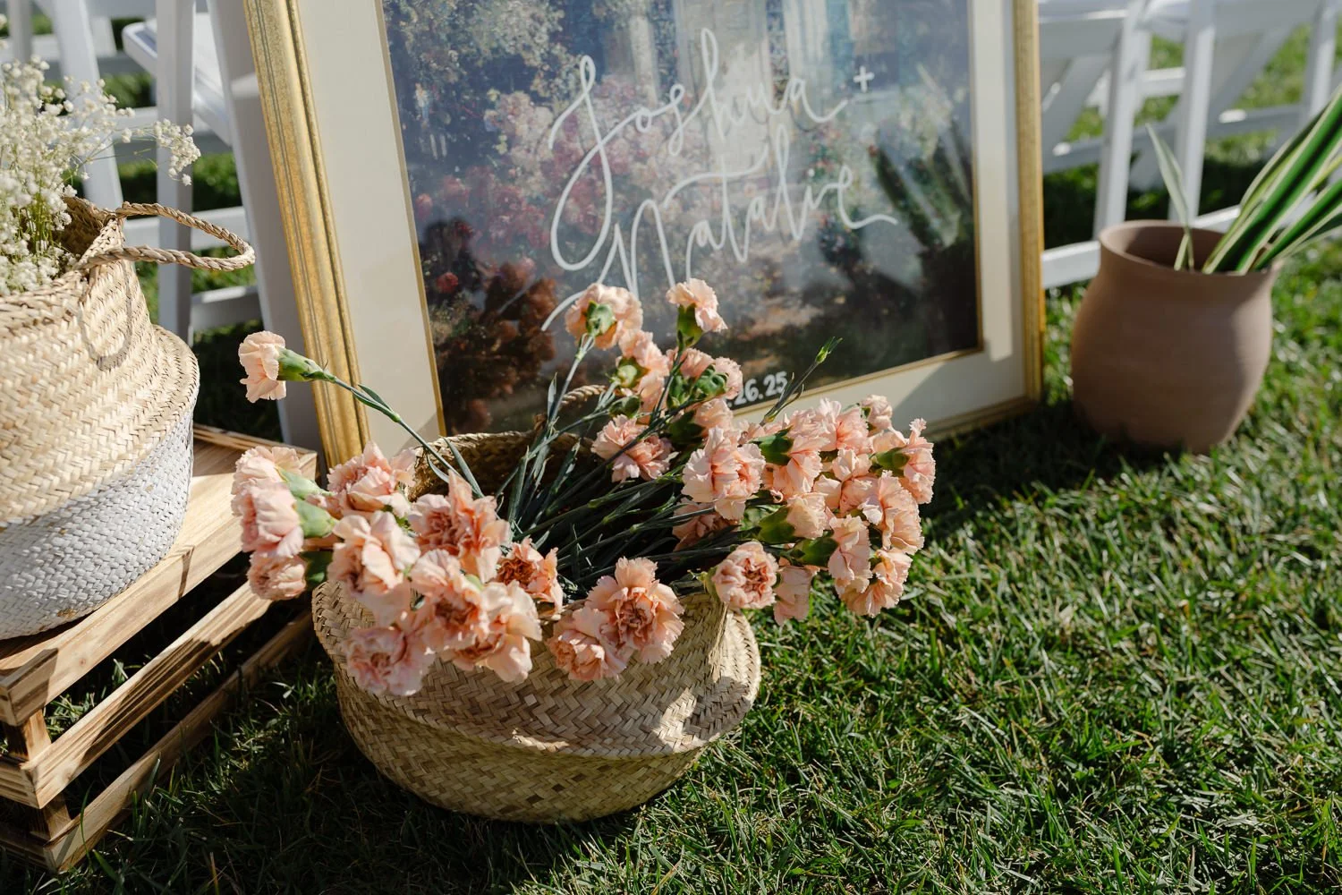 Wedding ceremony sign and floral styling at Ivory Meadows in Yellow Springs, Ohio.