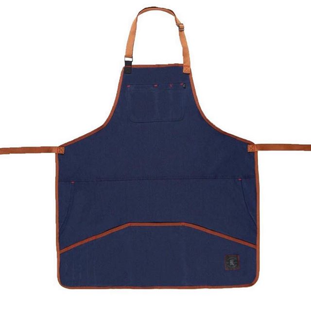 The Industry Apron, made from comfort stretch material (74% cotton, 24% poly, 2% spandex) with adjustable neck and waist straps. Waterproof! A large upper pocket with pen slots, jeans-style pockets on the sides, and large lower pockets provide all th