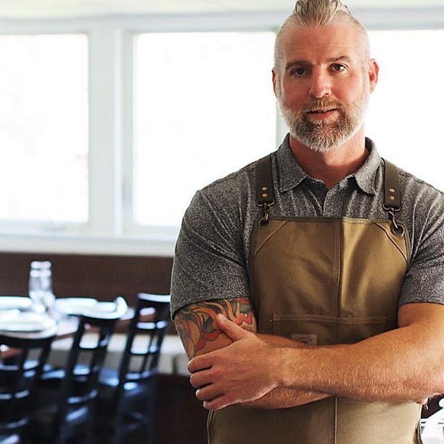 @jwilliamculinary wearing @knifeandflag &lsquo;s Core Apron in Olive, also available in Denim and Black! Purchase yours by clicking the photo or link in our bio! #knifeflag #casualstyle #apronstyle #survivalunion