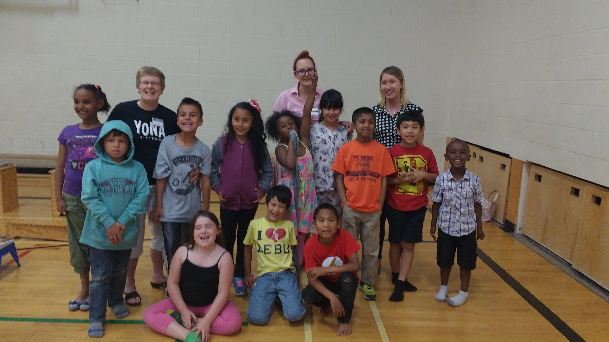 Mother Teresa Explorers students, celebrating with Ms. Joan, Ms. Daniella, and Ms. Danielle (two of our wonderful volunteers) after their year-end concert.