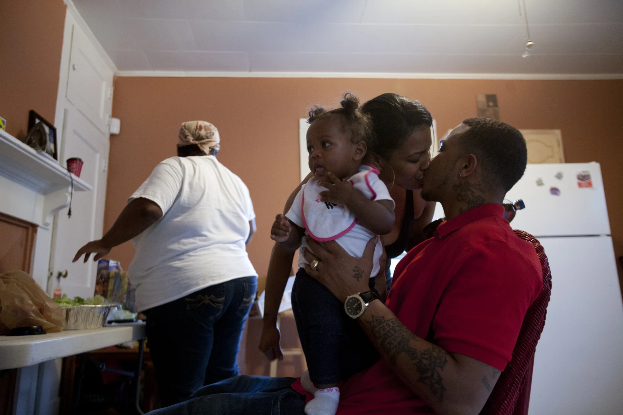 DJ and his wife, Shatillia, who he calls "T" or
"Tilli," kiss in the kitchen while she and her sister make dinner for
the family. DJ is holding their niece, whom they call "Mama."
Normal
0
false
false
false
EN-US
JA
X-NONE
/* Style Definitions */
table.MsoNormalTable
{mso-style-name:"Table Normal";
mso-tstyle-rowband-size:0;
mso-tstyle-colband-size:0;
mso-style-noshow:yes;
mso-style-priority:99;
mso-style-parent:"";
mso-padding-alt:0in 5.4pt 0in 5.4pt;
mso-para-margin:0in;
mso-para-margin-bottom:.0001pt;
mso-pagination:widow-orphan;
font-size:12.0pt;
font-family:Cambria;
mso-ascii-font-family:Cambria;
mso-ascii-theme-font:minor-latin;
mso-hansi-font-family:Cambria;
mso-hansi-theme-font:minor-latin;}
DJ and Tilli have known each other for many years. They used
to work together on drug deals and frauds. She took one of his prison sentences
this year and served seven months. If she hadn't, DJ would have been in prison
for 17 years.
And they might be pregnant. Tilli hopes it's a girl.