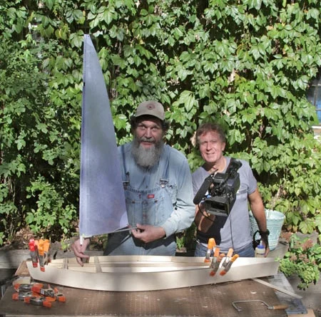I built a sailboat to carry Maire Kent's ashes to the sea. Here is a photo of Keith Famie and me in my backyard in Minneapolis. The boat is finished and will launch in June 2014.