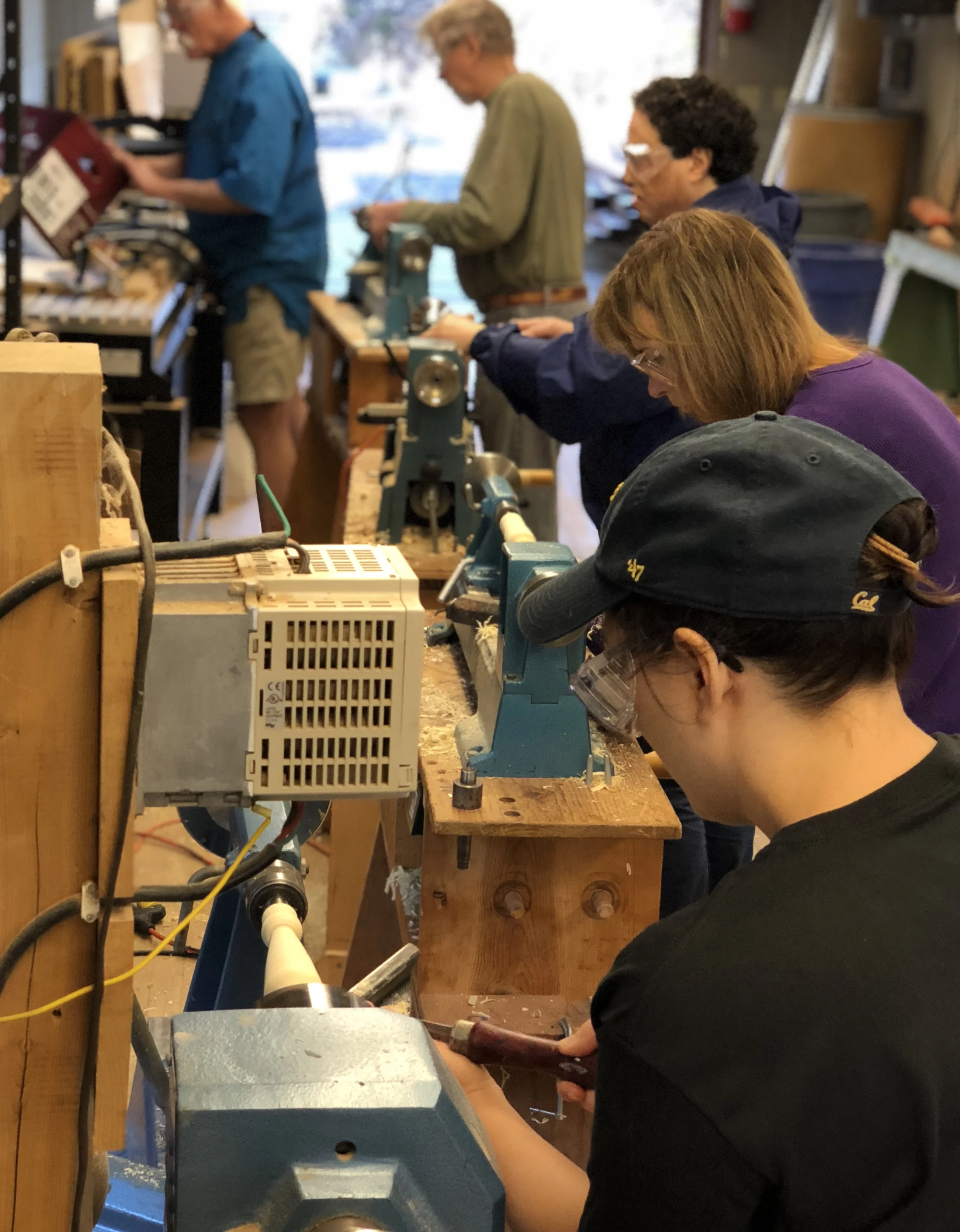Woodworkers all in a line using lathes.jpg