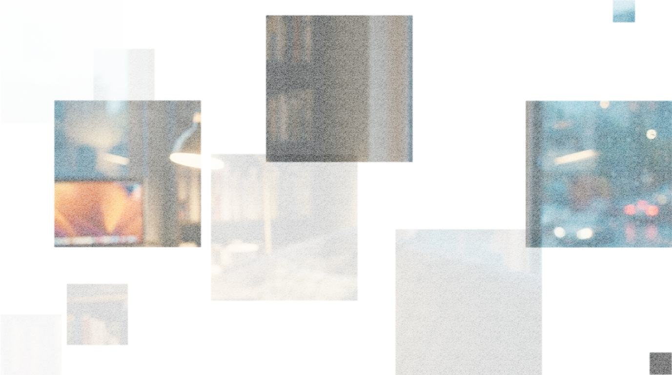 A cozy living room with a window showing a rainy street scene, a bookshelf filled with books, a table lamp, and a computer monitor on a desk.