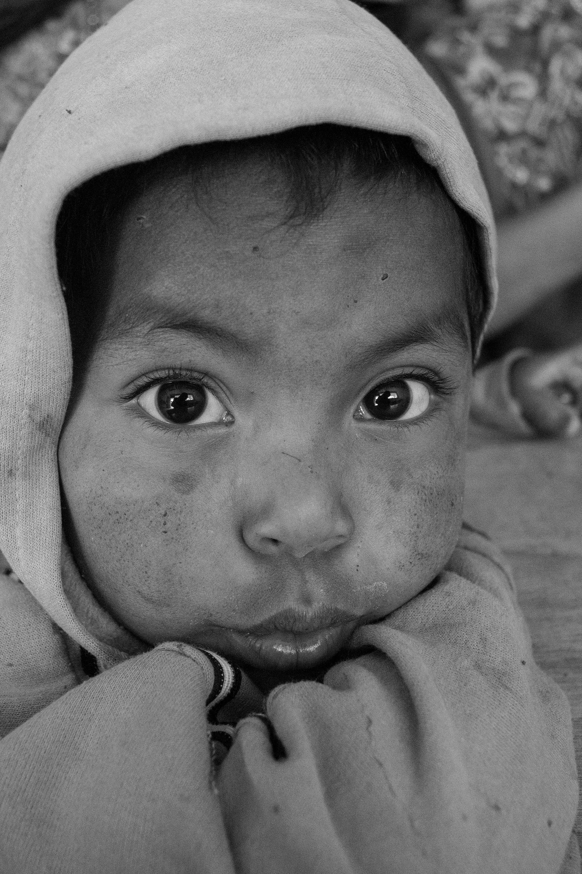 A Mayan Child with a dirty face in a small mountain top village outside the city of Quetzaltenango, locally know by its Mayan name, Xela. Water is a valuable and scarce resource in dusty highland villages, and often children go long periods of time without bathing.