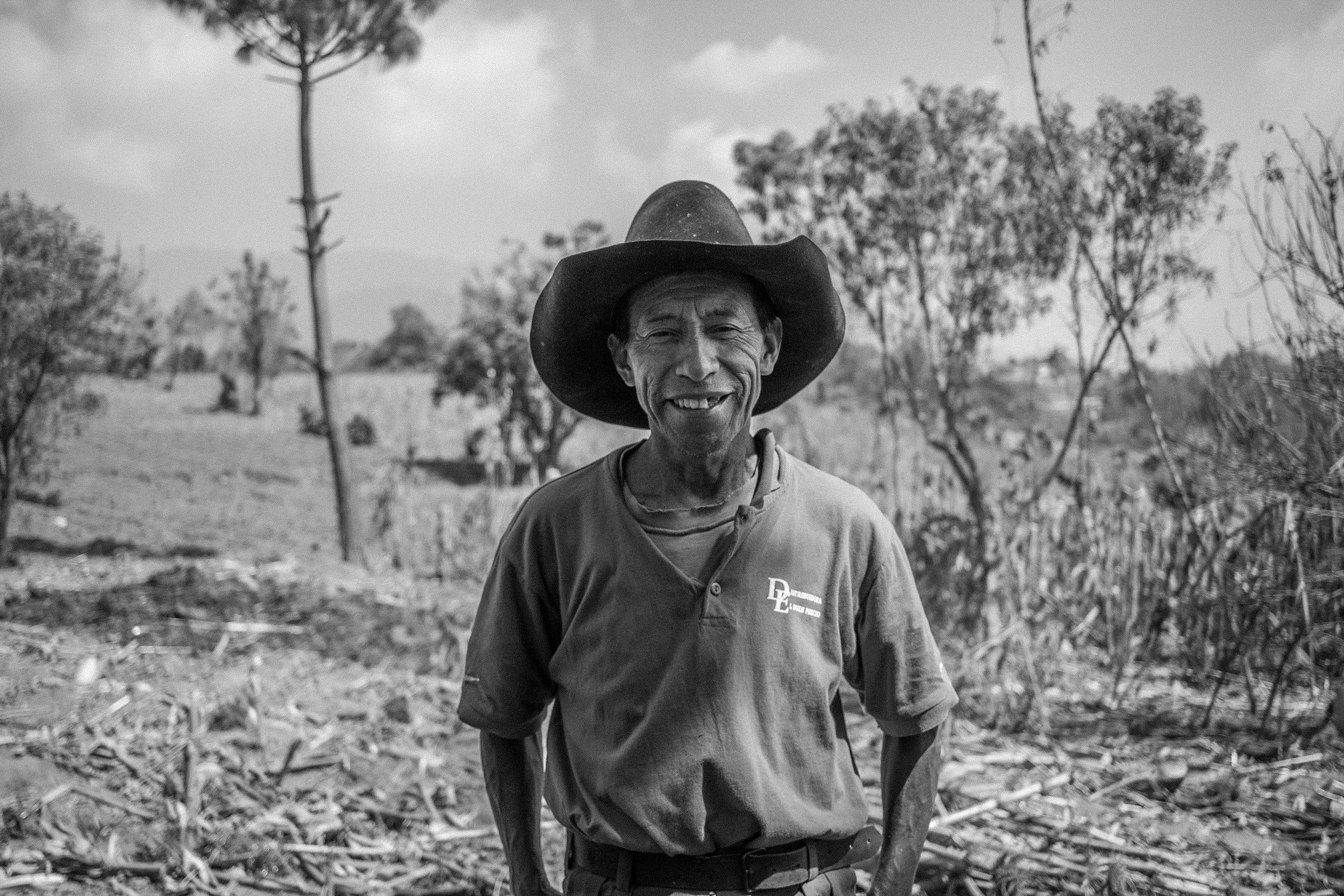 A Mayan farmer stands proudly before his land in the highland village of La Ilusion Chuiquel.