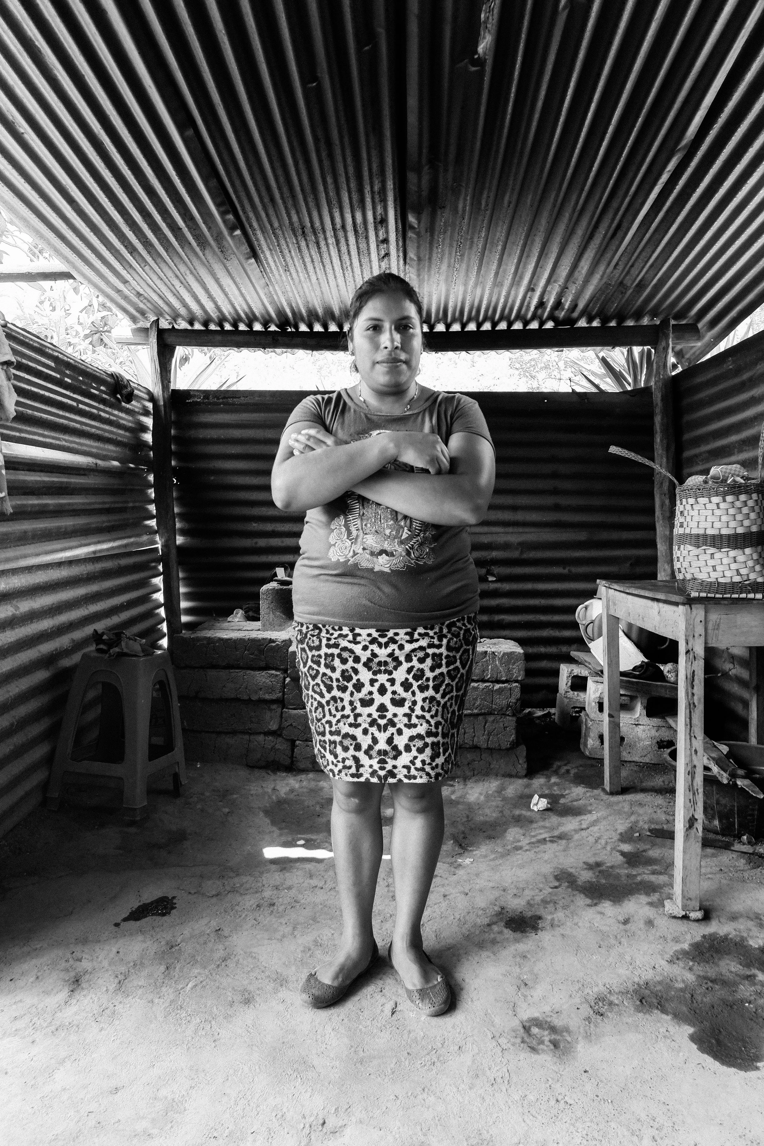 A Mayan woman stands proudly in her kitchen in the highland village of Las Joyas.