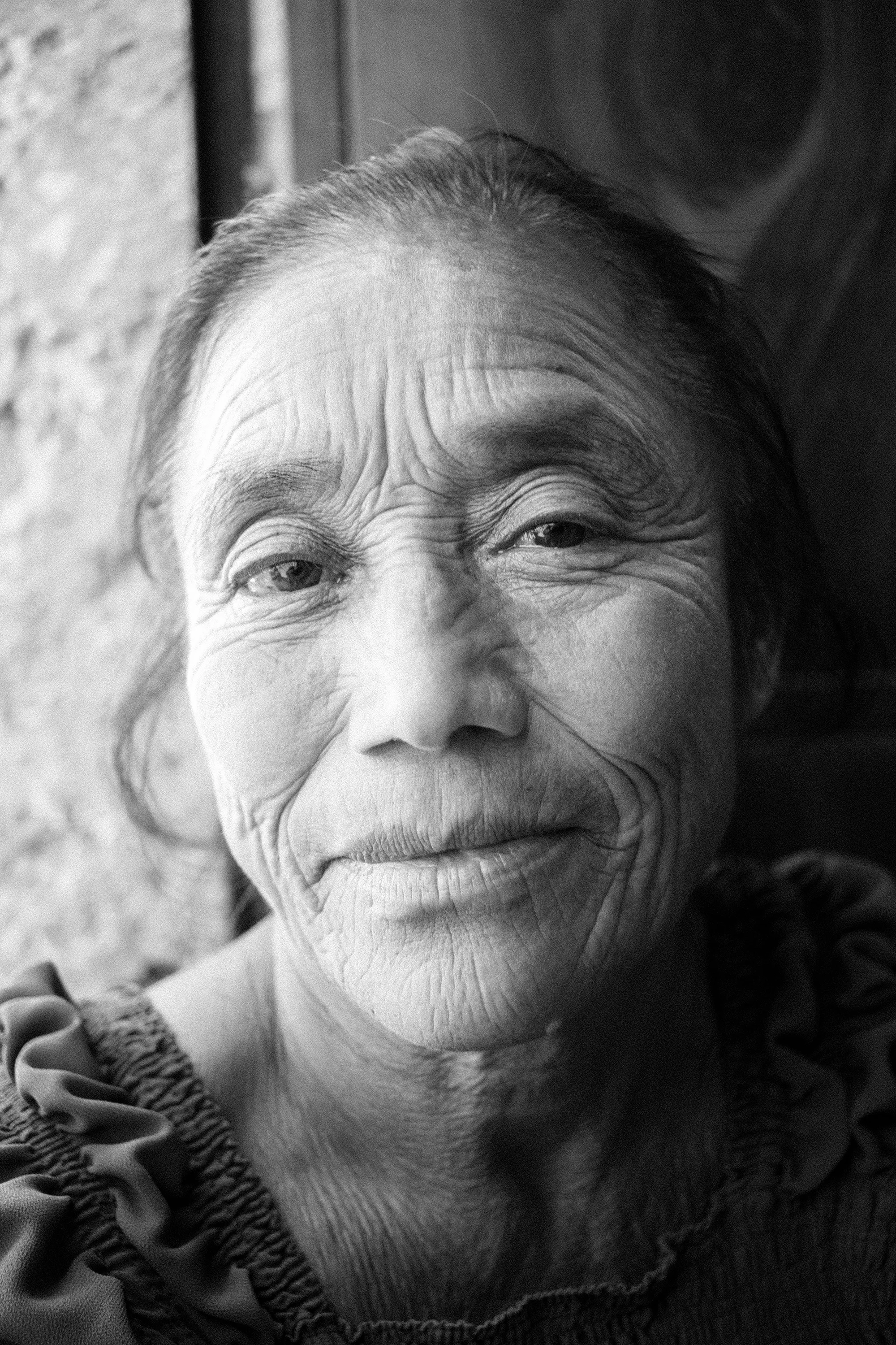 An older Mayan woman in a remote mountain top village outside the community of Chimaltenango, known locally by its Mayan name, Xela.