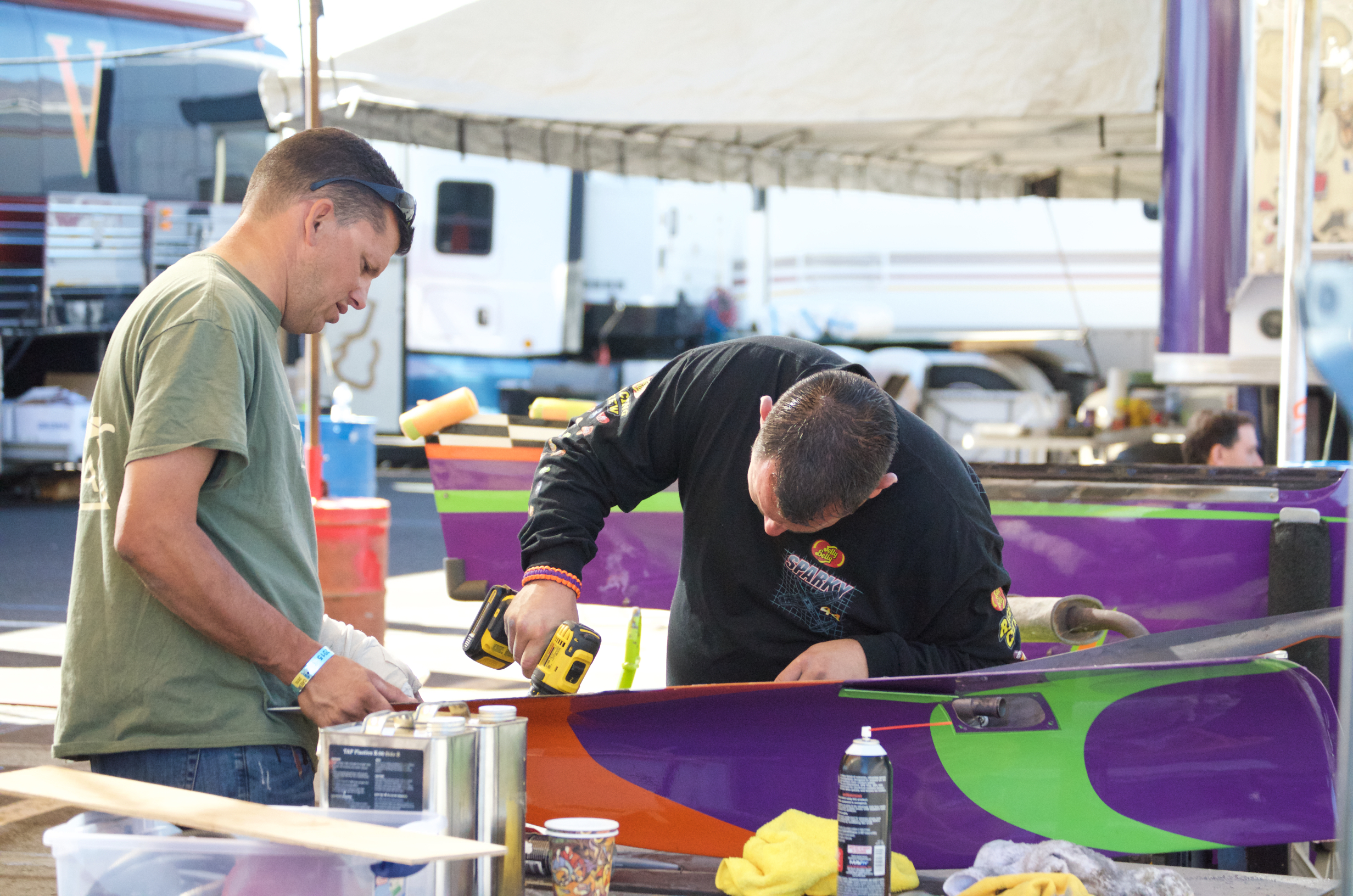 Crew members working on parts from Voodoo. Reno Stead Airport, National Championship Air Races 2015
