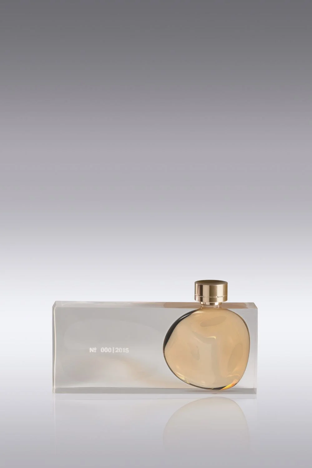 'Float' by LucidiPevere features a 'blobular' perfume reservoir trapped inside a rigid block of cast glass.Photo Gionata Xerra.