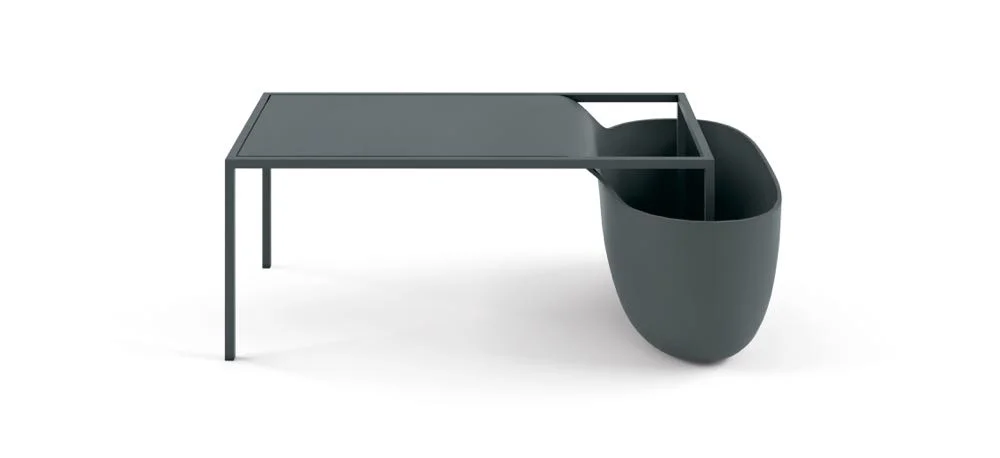 From Nendo's dissolving table series called 'Flow' for Alias . Each low table ends in what can only be described as a bucket made from polyurethane. Nendo's never-ending library of visual puns is quite extraordinary.