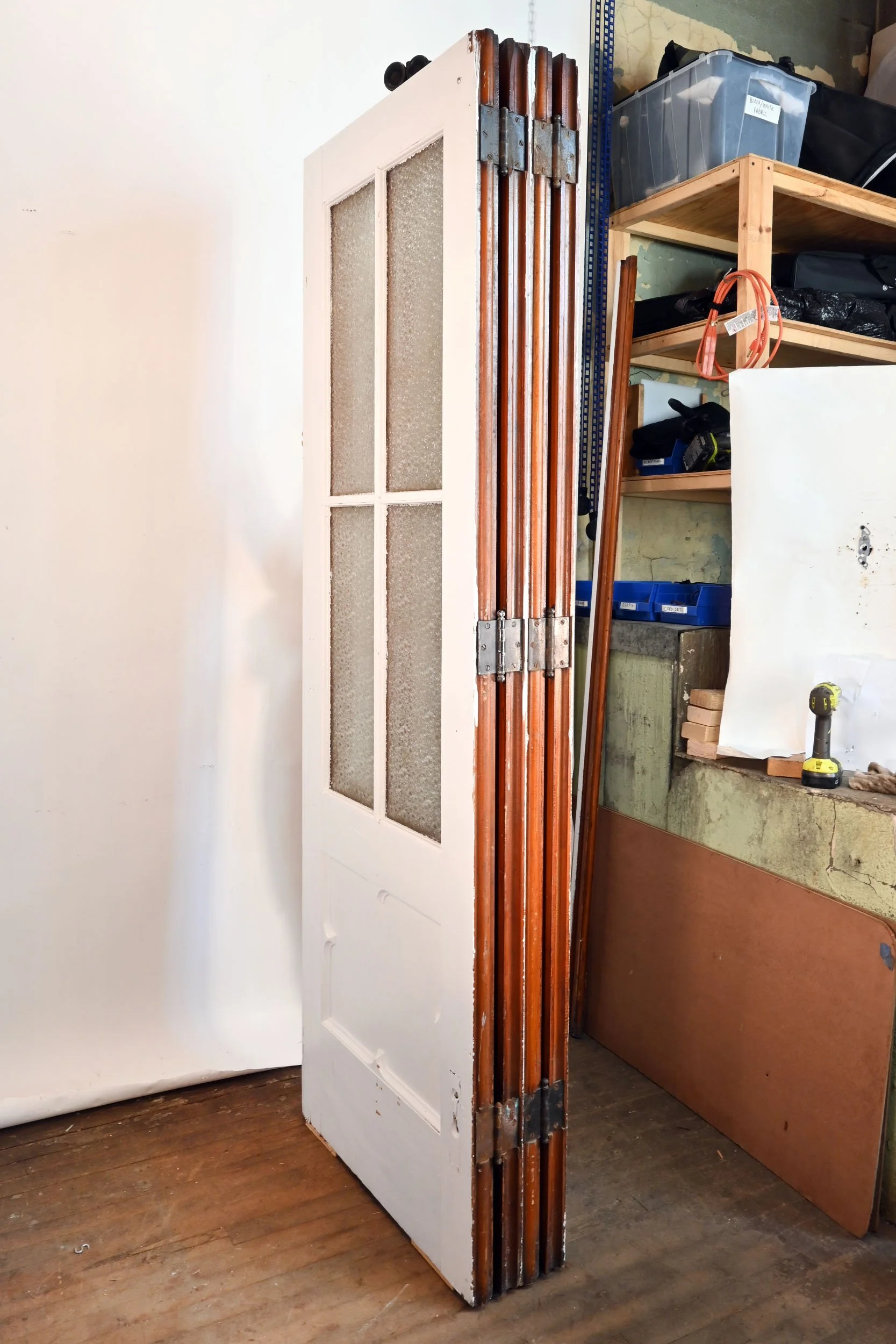 three panel oak bifold door unit with guide wheels and rail