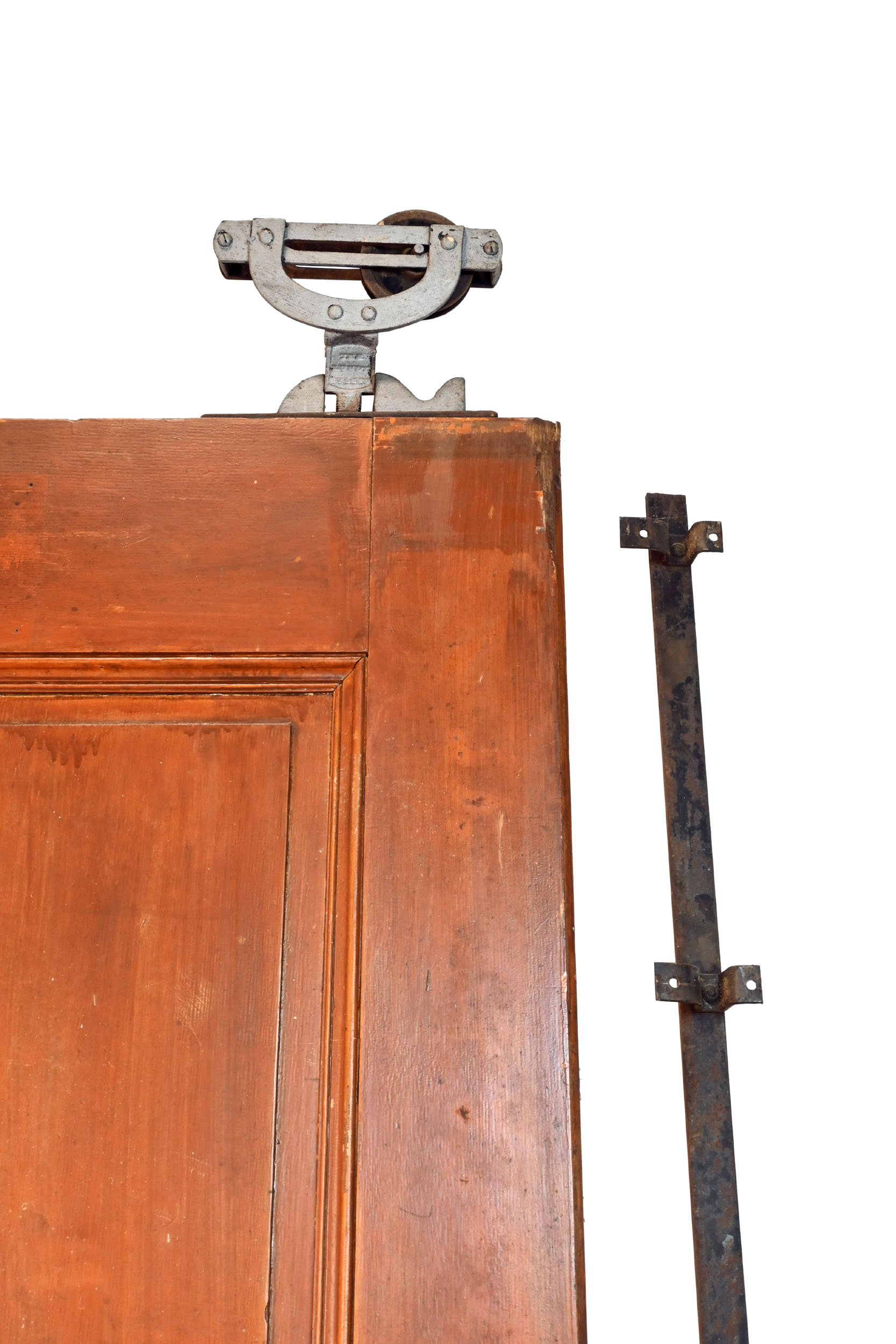 large distressed two panel pocket door with track and rollers