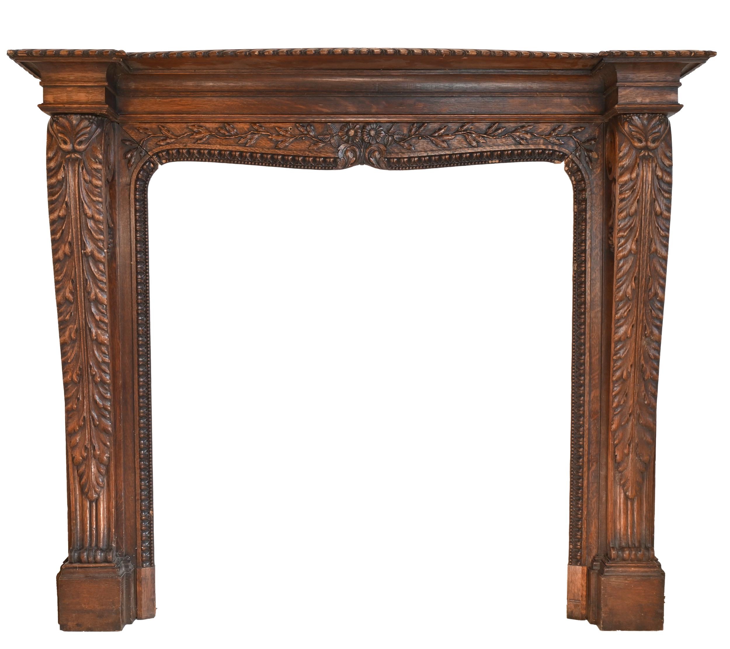 dark stain ornately carved tiger oak mantel