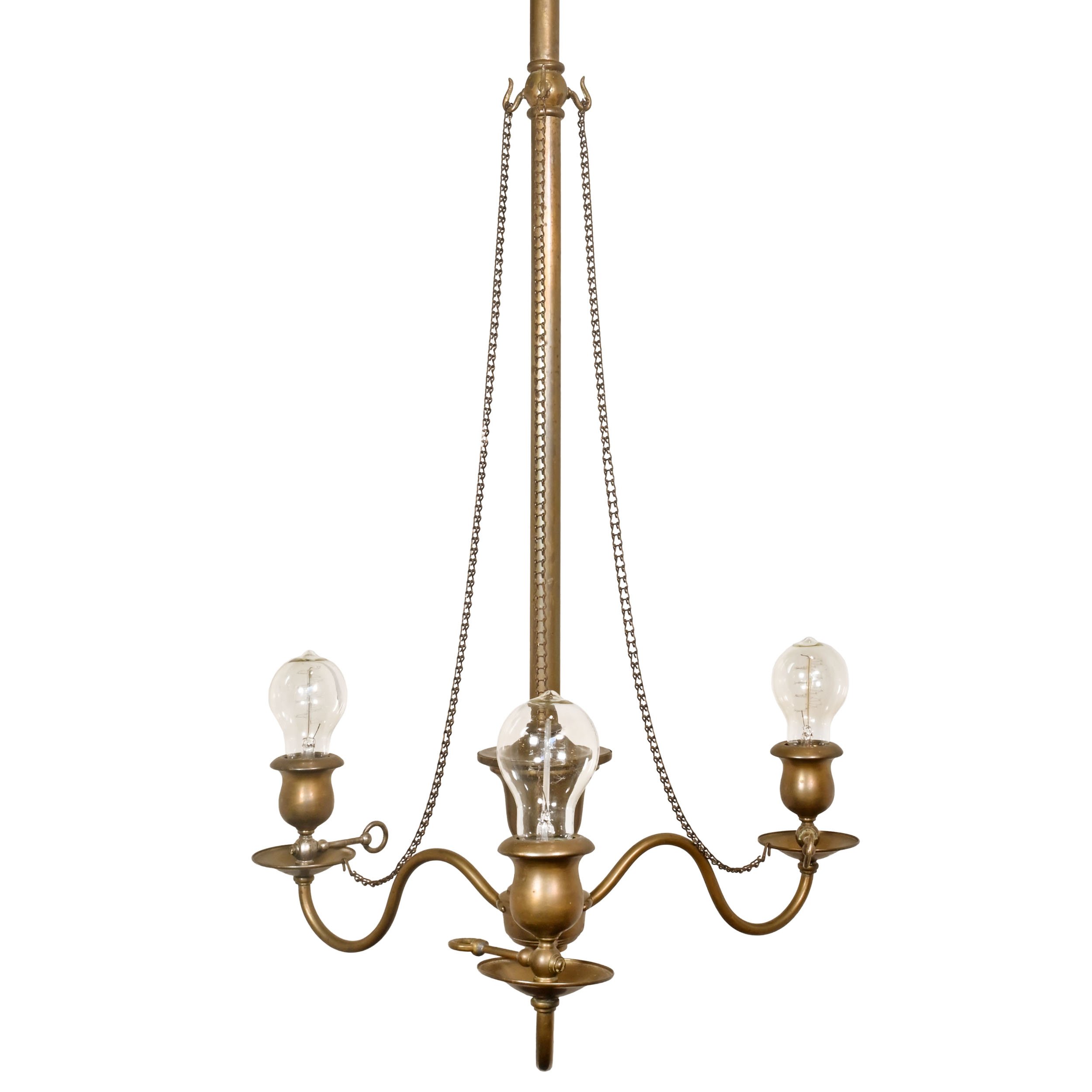 brass converted gas three light chandelier with decorative chain