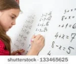 stock-photo-little-schoolgirl-writing-on-blackboard-133465625[3].jpg