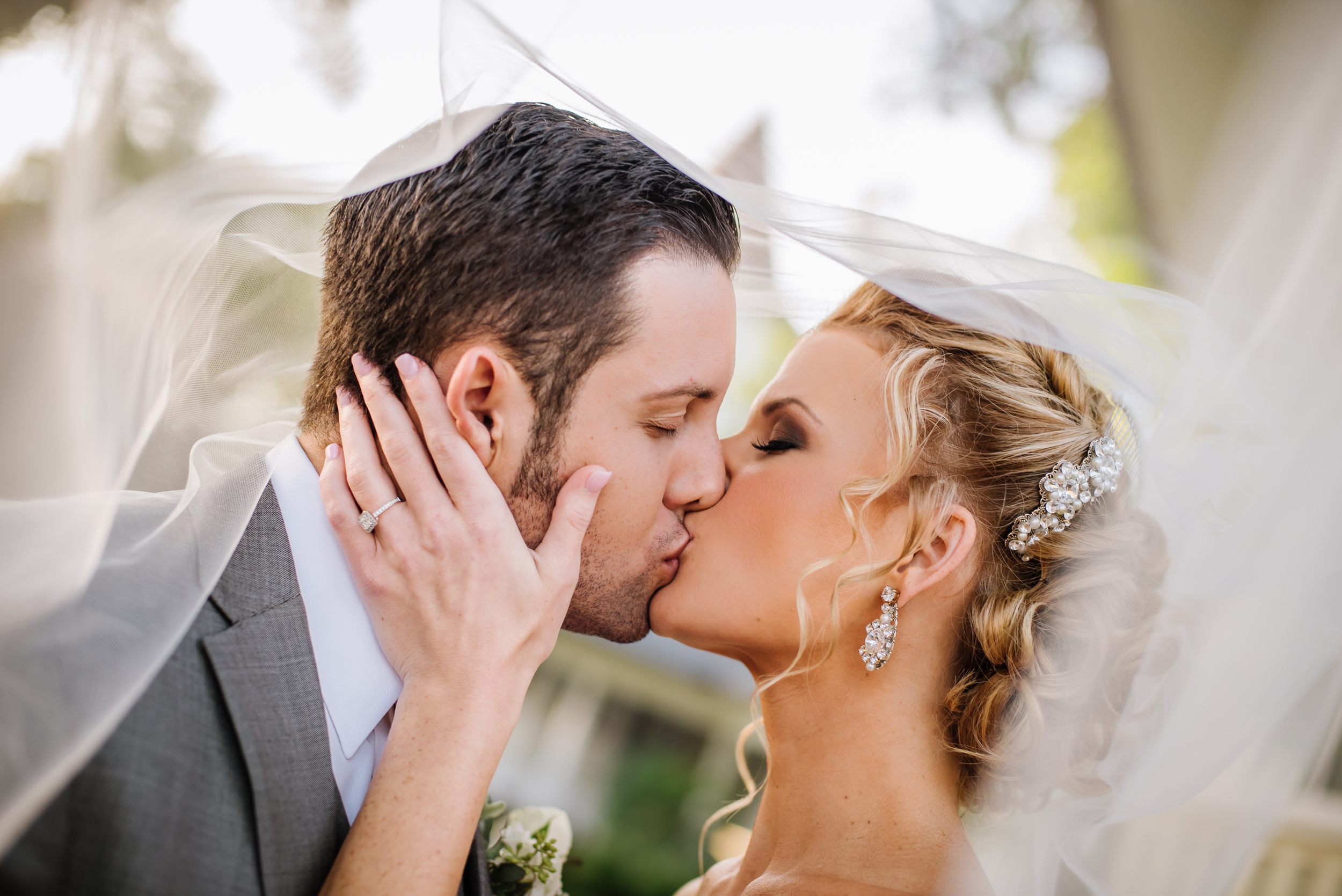 Shawna &amp; Anthony's day was all about romance and glamour. I love this sneaky through the veil frame of a sweet kiss.&nbsp;
