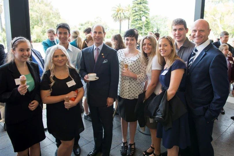 His Royal Highness; Prince Edward (center) standing with members of the Youth Focus Kokoda Team featured in the film