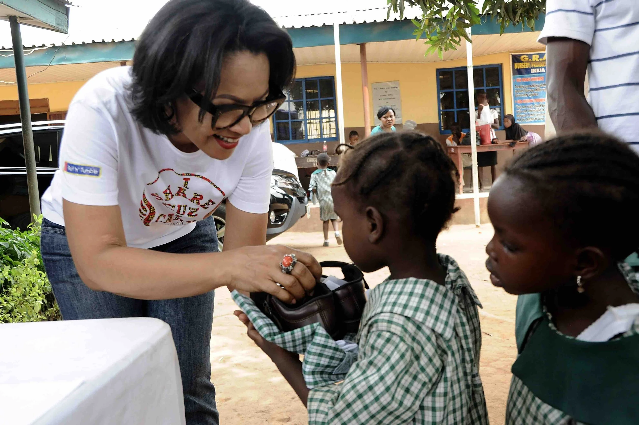 Unifomrs to children at a public primary school.jpg