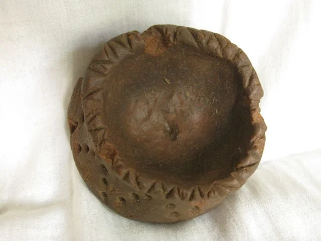 This is the oily one, showing the indentation made by the spindle, and some degraded places on the rim.
