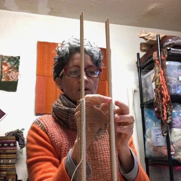 Studio activities include making a new bamboo reed for weaving.