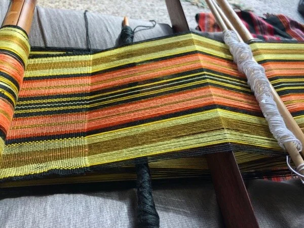 Since this is a circular warp, there is an unworked layer of warp threads underneath the working shed. This also means the tension of the warp has to be correct at the winding stage - something that still needs much work, in my case.