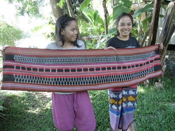 You want to know about that gorgeous piece lying underneath my current weaving? Keo wove that, and I bought it soon after I first met her. We had a photo session with Mone, shown here. It’s usually draped over a table, but I’m using it to wrap my weaving when I roll it up - maybe it will add good vibes from my teachers. If you’re not familiar with Katu textiles, all those white bits are beads, embedded with the weft yarn. I’m still working on my basic weaving skills before attempting much beading. For more of these sisters’ amazing work, look for The Weaving Sisters on FB or IG (linked at the beginning of this post), or if you find yourself in Luang Prabang!