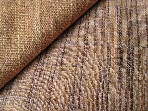 Close up of two khadi fabrics. The upper left piece is used in my duster (from the pockets to the hem, side front.) The other one plays a bit part in the  Inhabit  robe.